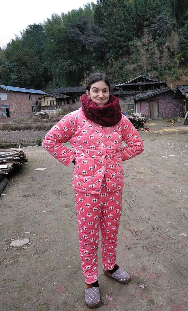 A woman wears a very warm and funny-looking pyjama to stay warm in winter.