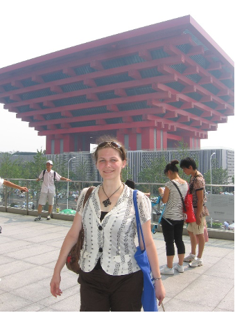 A picture of Katherine standing outside of the China Pavilion which is directly in the background